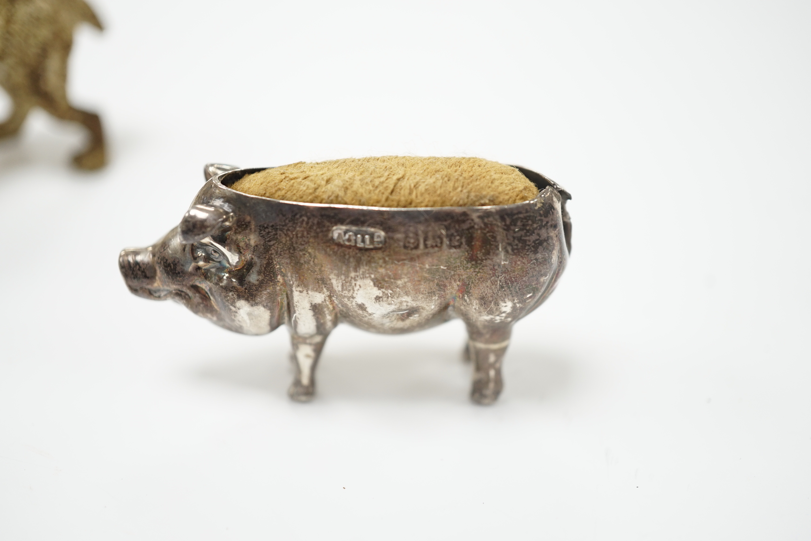 An Austrian cold painted dog, silver pig pin cushion, Adie & Lovekin, largest 6.5cm wide